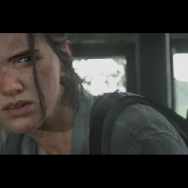 Close portrait of Ellie Williams holding a hatchet in an official The Last of Us Part II Photo Mode image