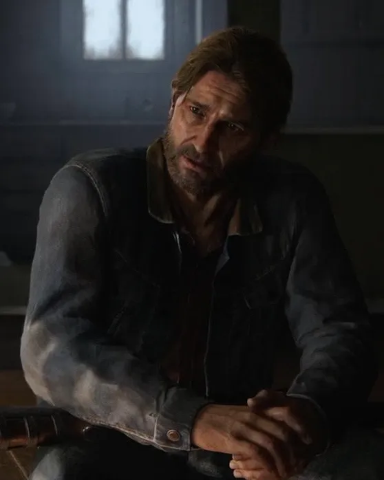 Tommy Miller sitting at a table in an in-game scene from The Last of Us Part II